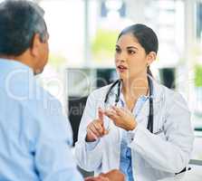 Heres what I would recommend.... Shot of a young female doctor giving a patient advice during a consultation.