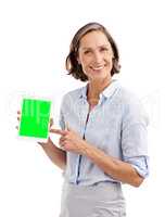 Inviting you to take a look at this website. Studio portrait of a well-dressed mature woman holding a digital tablet with a chroma key screen.