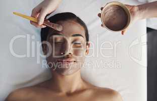 Cleanse your skin from deeper within. Shot of a young woman getting a facial treatment at a spa.