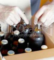 Lets get these boys ready for a party. Shot of bottled beer being boxed for distribution.