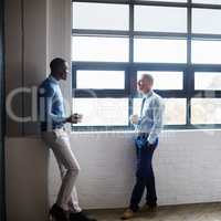 Id like us to explore some of your ideas further. Shot of two businessmen having a discussion in an office.