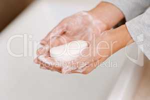 Shes germ-free now. Cropped shot of a woman washing her hands with soap.