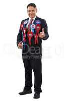 Put your trust in me. Portrait of a friendly looking politician wearing voting ribbons and giving you the thumbs up.