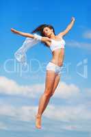 Flight of Freedom. A young woman in mid-air with her arms outstretched as if flying.