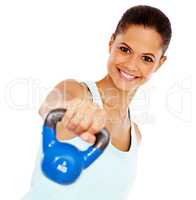 Weight training. Portrait of an attractive young woman exercising with a kettle bell.