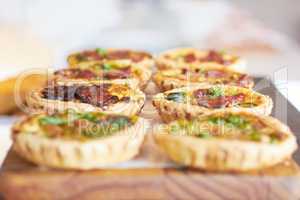 Mini quiches are the perfect snack. Cropped shot of a fresh batch of mini quiches.
