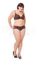 Curvaceous and proud of it. Full length portrait of a voluptuous woman in lingerie on a white background.