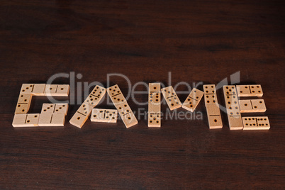 Game - The word is laid out from domino stones