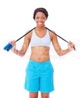 Skipping offers great cardio. Pretty young african american woman holding a skipping rope around her neck against a white background.