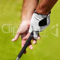 The proper grip is important. Cropped image of a golfer demonstrating the proper grip.