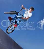 Practicing for the x games. Cropped shot of a teenage boy riding a bmx at a skatepark.