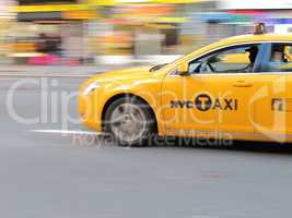 Taxi in New York - lens and motion blurred. Taxi in New York - lens and motion blurred.