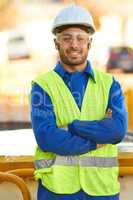 Confident in his construction ability. Portrait of a construction worker wearing protective glasses and smiling at you.