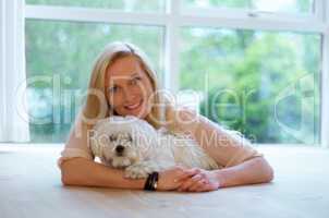 Womans best friend too. A woman bonding with her Maltese poodle.