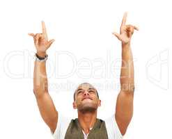 Ultimate success. Young man with arms raised and pointing in gesture of happy victory, isolated on white - copyspace.