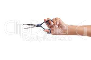 Time for a new hairstyle. Cropped shot of a woman holding a pair of haircutting scissors.