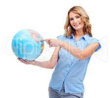 Travel to any destination you desire - Tourism Travel. A pretty young woman pointing to the Gulf of Mexico on a world globe.