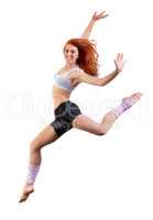 She loves to dance. Young dancer jumping against a white background.