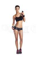 My workout buddy. Portrait of a fit young woman in sportswear holding resistance bands isolated on white.