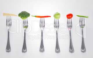 Mouthful of goodness. A series of forks with healthy mouthfuls of vegetables on them.