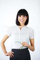 An asset to her company. Portrait of a confident businesswoman holding glasses and smiling at you.