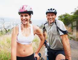 Biking buddies. Portrait of a healthy sporting couple going for a bike ride together.