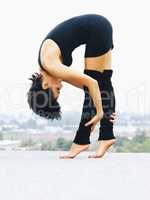 Urban dance. A contemporary female dancer posing on a roof.