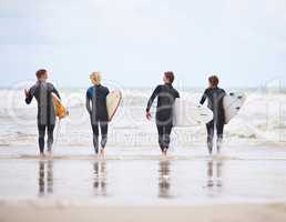 Surfing is beyond invigorating. Young surfers excited about hitting the awesome waves.