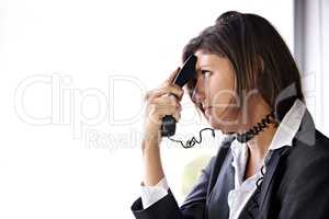The call that ruined her day.... A bored businesswoman with a phone pressed to her head and the cord wrapped around her neck.
