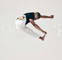 Every champion was once a contender who refused to give up. Studio shot of a young martial artist practicing.