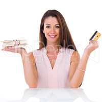 Cash or credit. Studio shot of a young woman with money to spend.