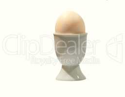 Egg cup. Egg in egg cup on white table top - isolated.