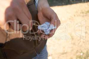 The good times are about to go bad. Shot of a person crushing up narcotics in a wrapper.