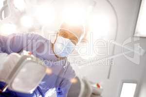 A light at the end of the tunnel. Patients view of a doctor trying to resuscitate himher with a defibrillator.