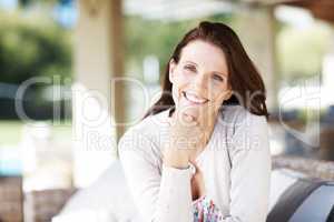 The sunlight and fresh air does wonders for me. Portrait of an attractive woman having a relaxing time outdoors.