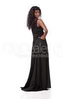 A dress that shows off her best assets. A beautiful indian woman in a long black dress.