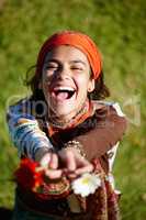 Freedom lies in being bold. Shot of a young woman laughing in the outdoors.