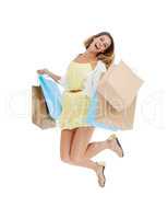 Ecstatic about deals. Full length studio portrait of a smiling woman carrying many shopping bags and jumping.