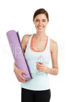 Be a no excuse kinda girl. Portrait of a beautiful young woman holding her exercise mat and a bottle of water.