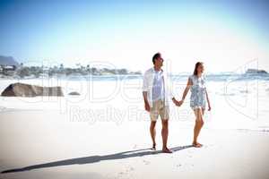 True love lasts a lifetime. A happy mature couple taking a relaxing stroll on the beach together.