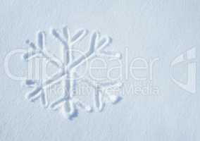 The snow has started falling. Shot of a snowflake symbol on a snow surface.