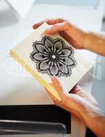 Home craft printing options. Cropped shot of a womans hands holding a wooden craft stamp.