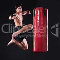 And any challenger will go down. Studio shot of a young mixed martial artist.