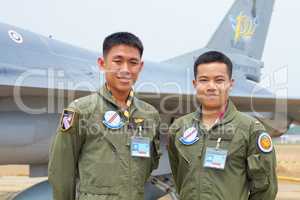 Pilot and copilot - brothers in arms. A shot of two confident asian fighter pilots.