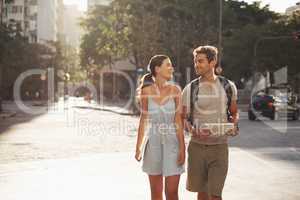 Enjoying the sights on their vacation. Cropped shot of a loving young couple touring a foreign city.