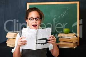 Wow These exercises look fun. A cute brunette girl looking fascinated by the book she is holding.