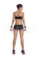 Shaping the perfect body. Rearview studio shot of a fit young woman in sportswear holding dumbbells isolated on white.