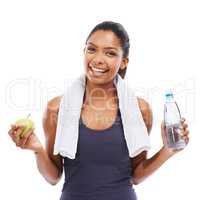 Healthy snack and water to wash it down - Healthy diet. A young woman holding a bottle of water and an apple after a workout.