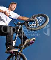 Practicing for the x games. Cropped shot of a teenage boy riding a BMX at a skatepark.