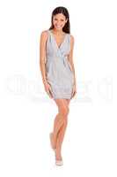 Shes perfect for the runway. Full-length studio portrait of a beautiful young woman posing in a gray dress.